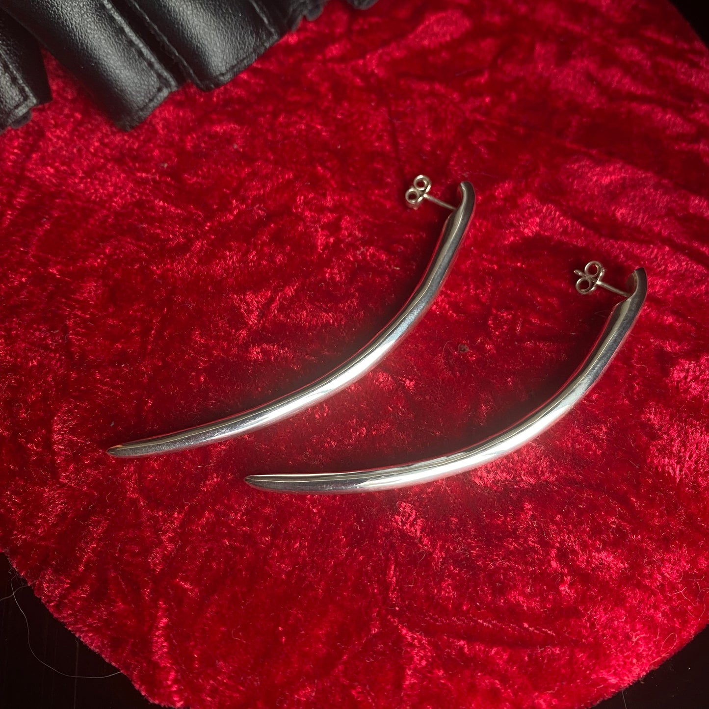 Long minimalist sterling silver curved spike earrings.
