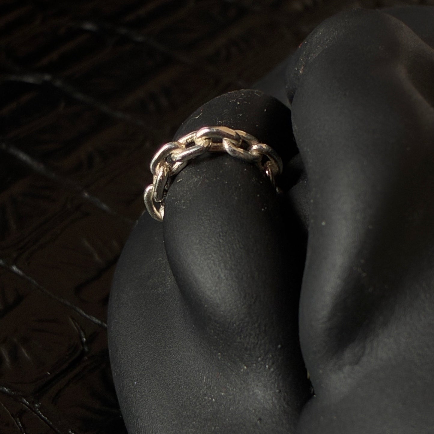 A chain lip cuff in sterling silver.