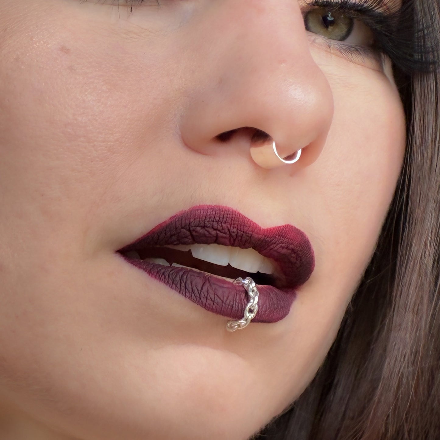A chain lip cuff in sterling silver.