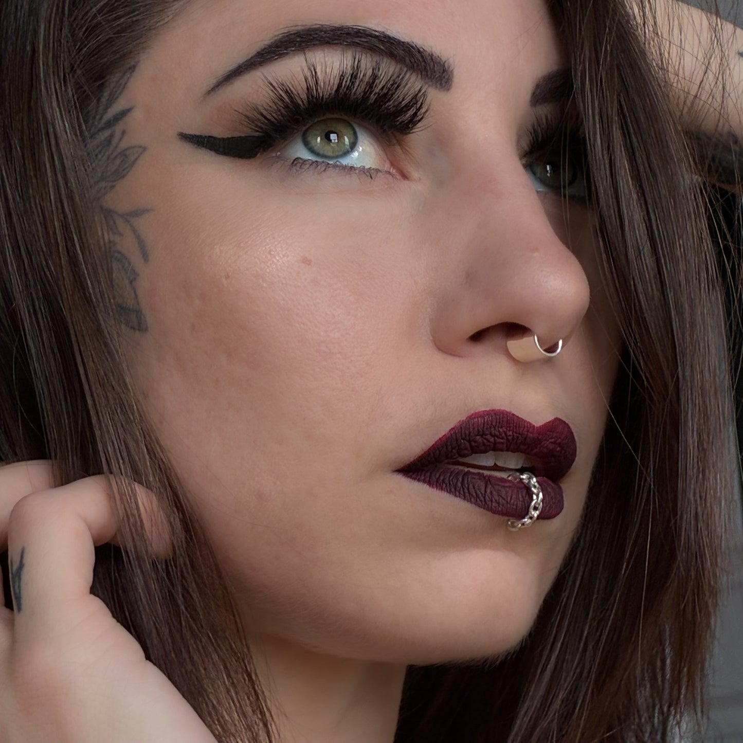 A chain lip cuff in sterling silver.