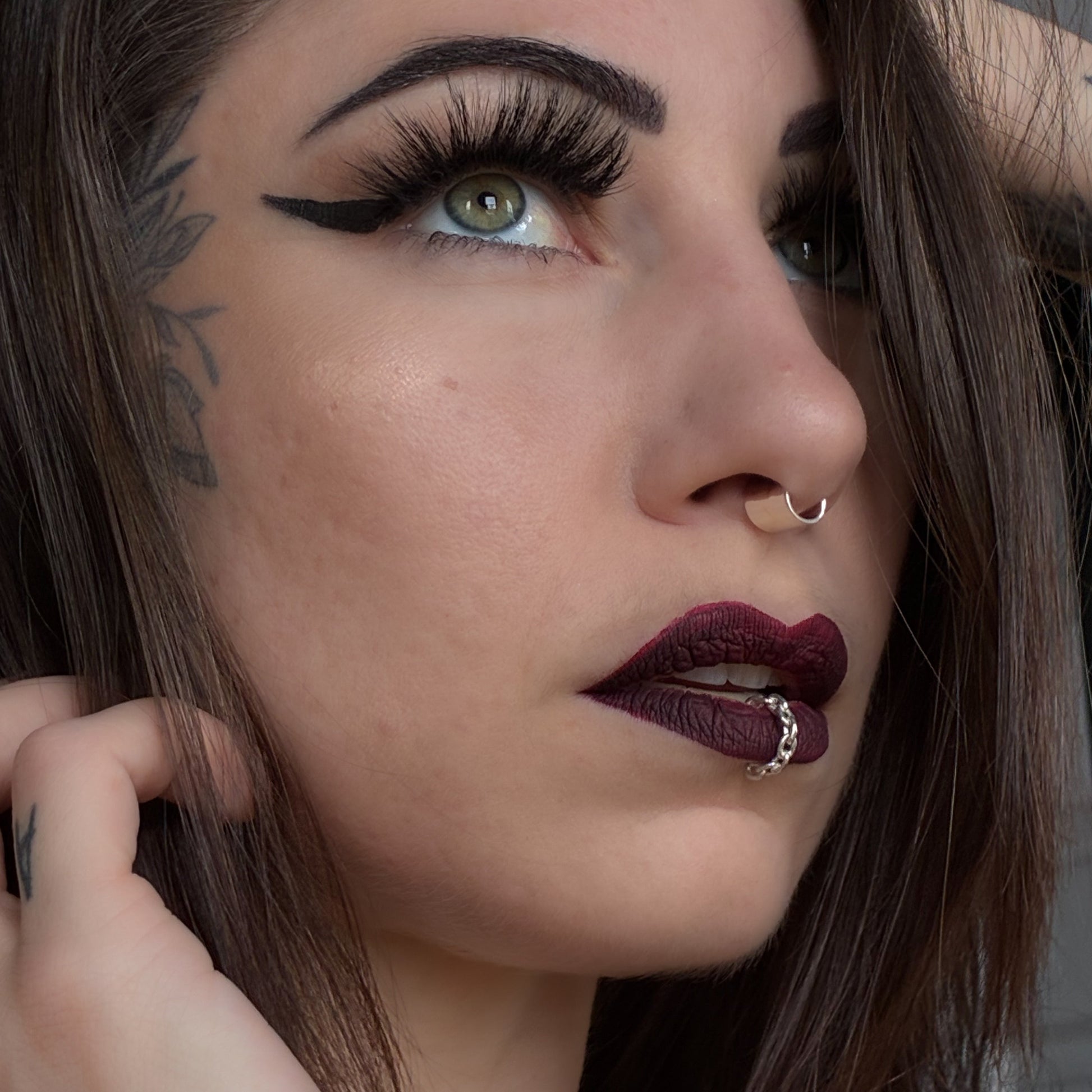 A chain lip cuff in sterling silver.