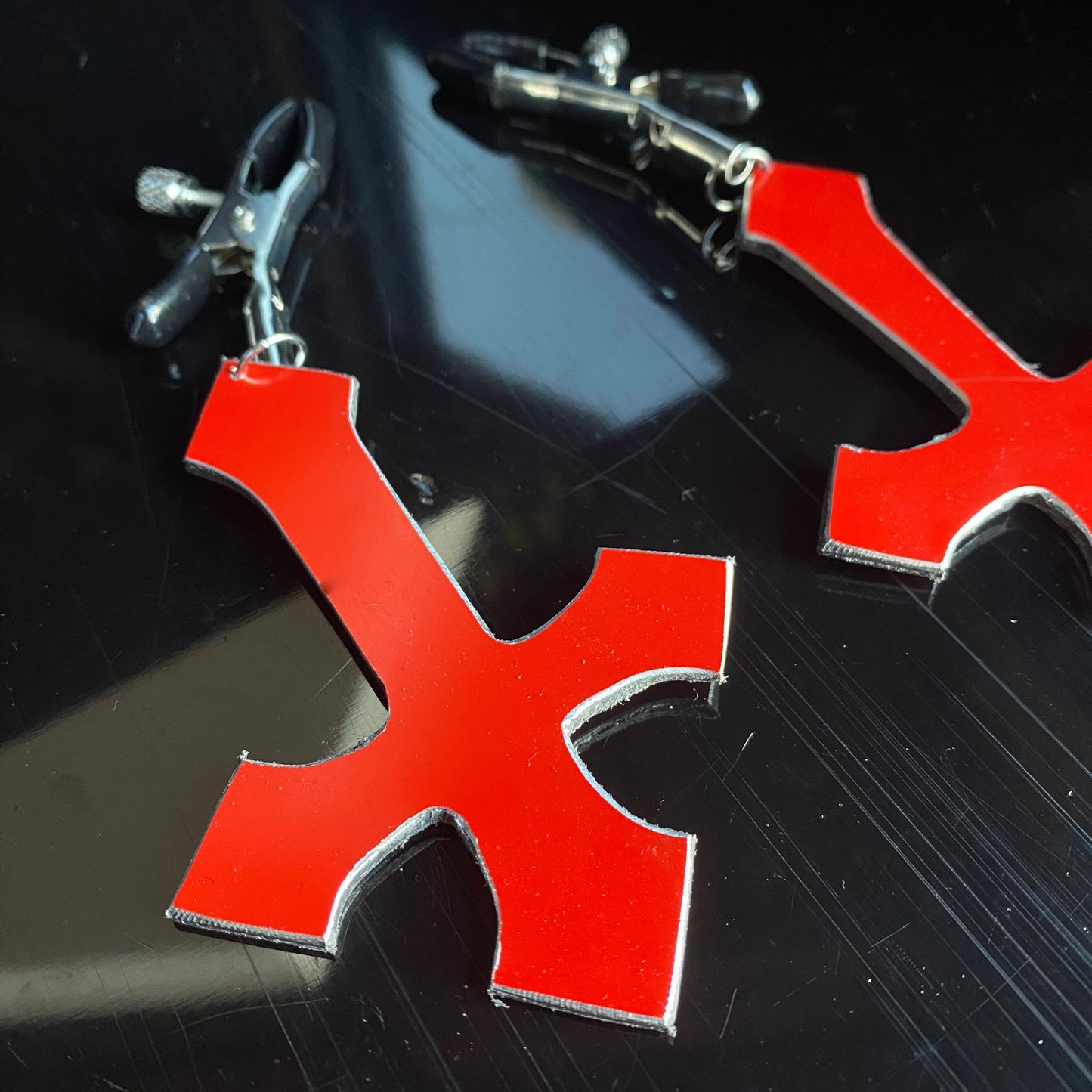 Heretic - inverted red cross nipple clamps
