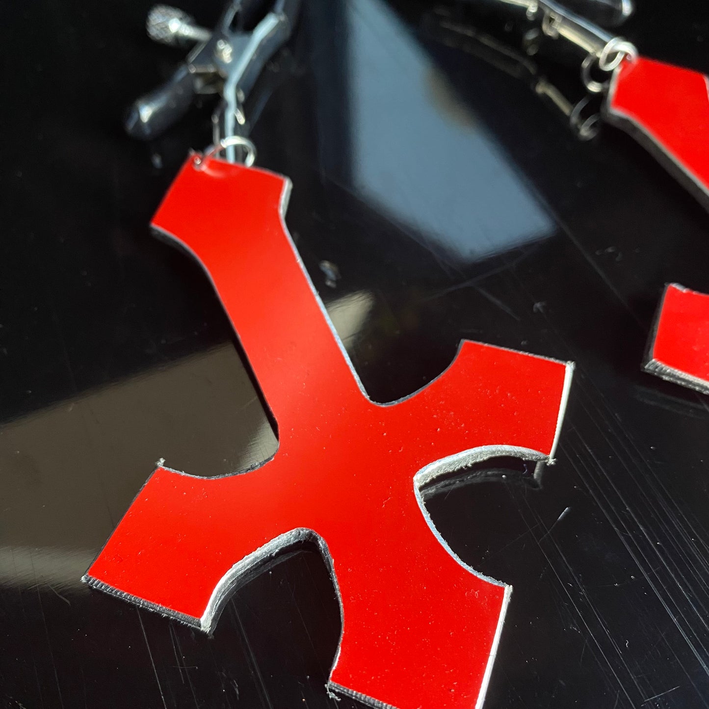Heretic - inverted red cross nipple clamps