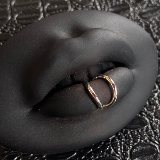 A double ring lip cuff in sterling silver.  